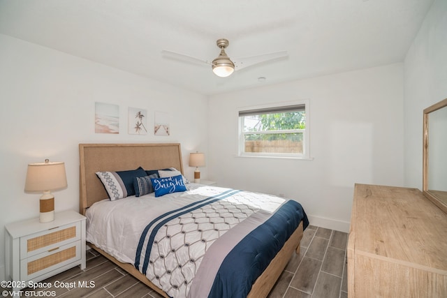 201 NE 3rd St, Satellite Beach, FL 32937 - bedroom featuring wood finish floors, baseboards, and ceiling fan