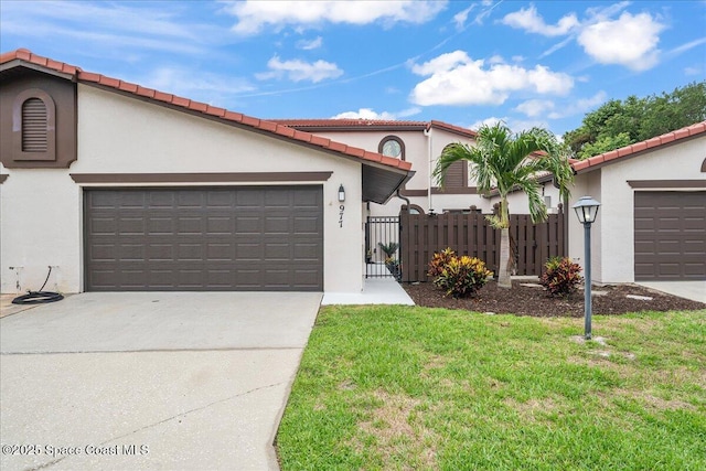 977 Osprey Dr, Melbourne, FL 32940 - mediterranean / spanish-style house with stucco siding, concrete driveway, an attached garage, and a tiled roof