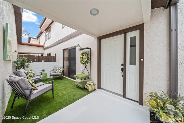 977 Osprey Dr, Melbourne, FL 32940 - doorway to property featuring stucco siding