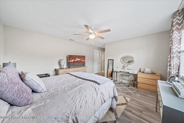 977 Osprey Dr, Melbourne, FL 32940 - bedroom featuring light wood-style floors and ceiling fan