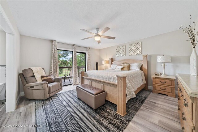 977 Osprey Dr, Melbourne, FL 32940 - bedroom with access to exterior, light wood-style flooring, a textured ceiling, baseboards, and ceiling fan