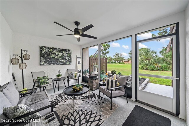 977 Osprey Dr, Melbourne, FL 32940 - sunroom / solarium featuring a ceiling fan and an outdoor hangout area