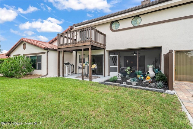 977 Osprey Dr, Melbourne, FL 32940 - back of property featuring stucco siding and a lawn