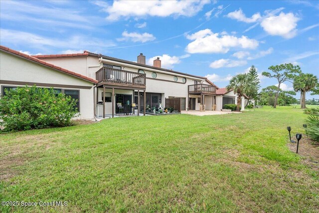 977 Osprey Dr, Melbourne, FL 32940 - rear view of property with a chimney, stucco siding, a yard, and a patio
