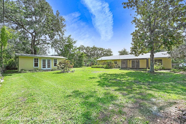 211 Naylor Dr, Melbourne, FL 32904 - view of green lawn featuring french doors