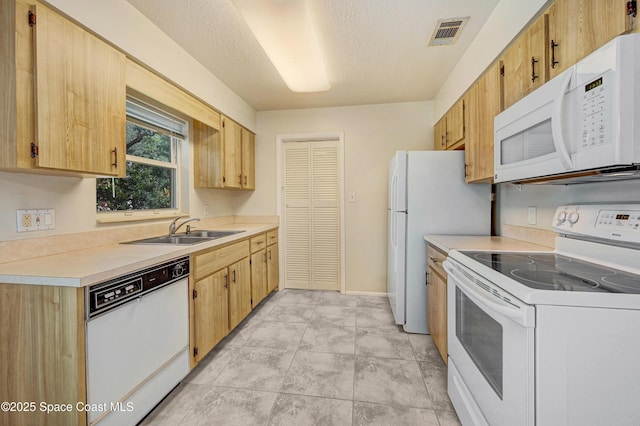 211 Naylor Dr, Melbourne, FL 32904 - kitchen with white appliances, light countertops, and a textured ceiling