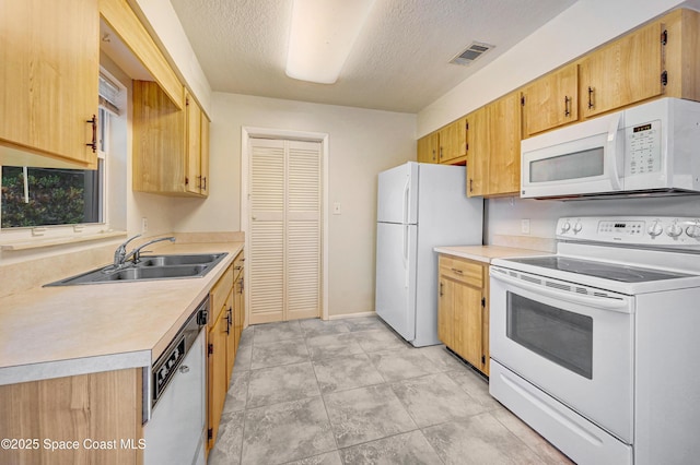 211 Naylor Dr, Melbourne, FL 32904 - kitchen with white appliances, light countertops, and a textured ceiling