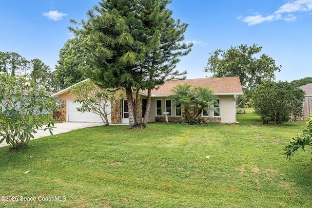 790 Alfonso Ave SE, Palm Bay, FL 32909 - view of front of house with a garage, driveway, a front lawn, stone siding, and stucco siding