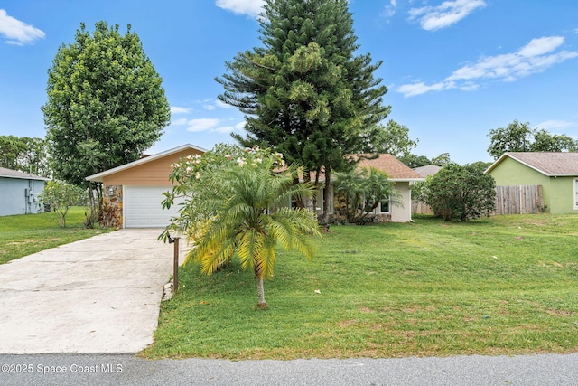 790 Alfonso Ave SE, Palm Bay, FL 32909 - obstructed view of property with a garage and concrete driveway