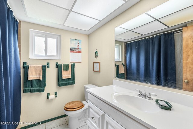 790 Alfonso Ave SE, Palm Bay, FL 32909 - full bath featuring toilet, vanity, tile patterned flooring, and a shower with curtain