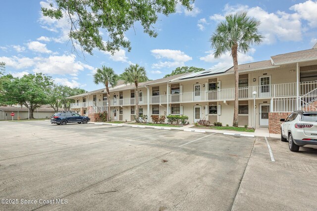 1600 Woodland Dr Unit 4105, Rockledge, FL 32955 - view of apartment building / complex with uncovered parking