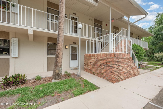 1600 Woodland Dr Unit 4105, Rockledge, FL 32955 - property entrance featuring stucco siding and a porch