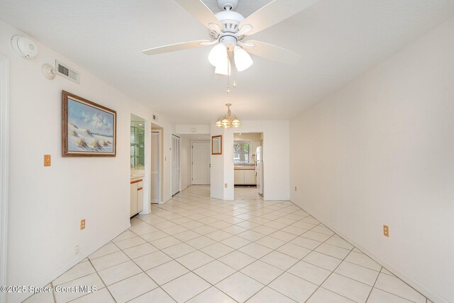 1600 Woodland Dr Unit 4105, Rockledge, FL 32955 - empty room with ceiling fan, a chandelier, a smoke detector, and light tile patterned floors