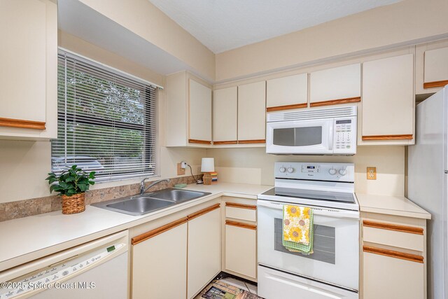 1600 Woodland Dr Unit 4105, Rockledge, FL 32955 - kitchen with white appliances, a sink, and light countertops