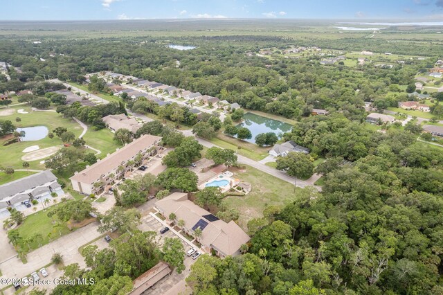 1600 Woodland Dr Unit 4105, Rockledge, FL 32955 - aerial view of property's location with a nearby body of water, nearby suburban area, a local golf course, and a heavily wooded area