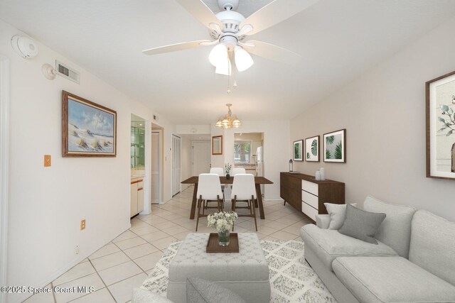 1600 Woodland Dr Unit 4105, Rockledge, FL 32955 - living area with light tile patterned floors, ceiling fan, and a chandelier