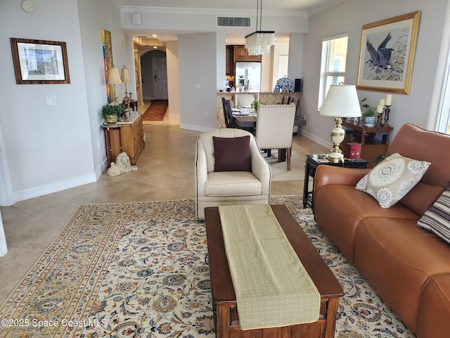 93 Delannoy Ave Unit 601, Cocoa, FL 32922 - living room with arched walkways, ornamental molding, and a chandelier