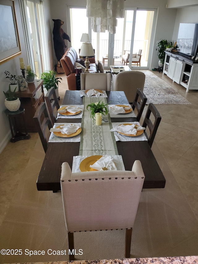 93 Delannoy Ave Unit 601, Cocoa, FL 32922 - tiled dining area featuring baseboards