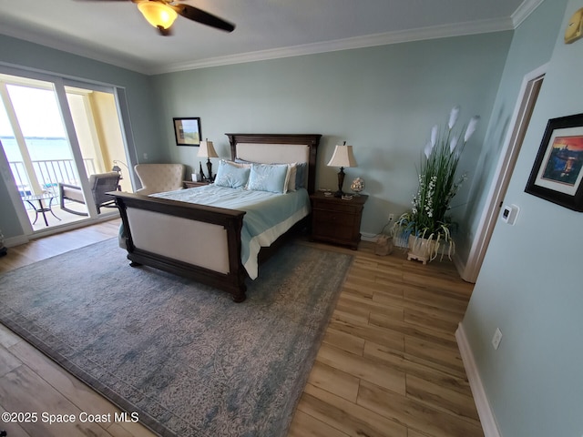 93 Delannoy Ave Unit 601, Cocoa, FL 32922 - bedroom featuring wood finished floors, ornamental molding, access to outside, and ceiling fan