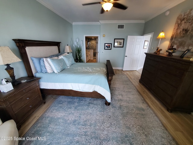 93 Delannoy Ave Unit 601, Cocoa, FL 32922 - bedroom with wood finished floors, ornamental molding, and a ceiling fan