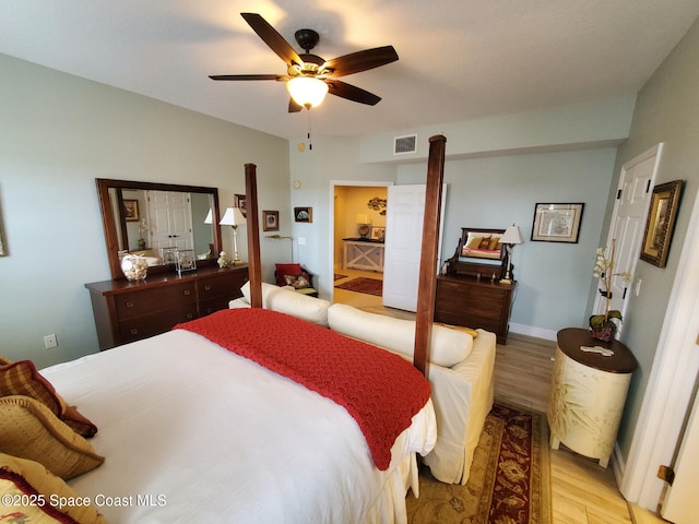 93 Delannoy Ave Unit 601, Cocoa, FL 32922 - bedroom with light wood-style flooring and ceiling fan