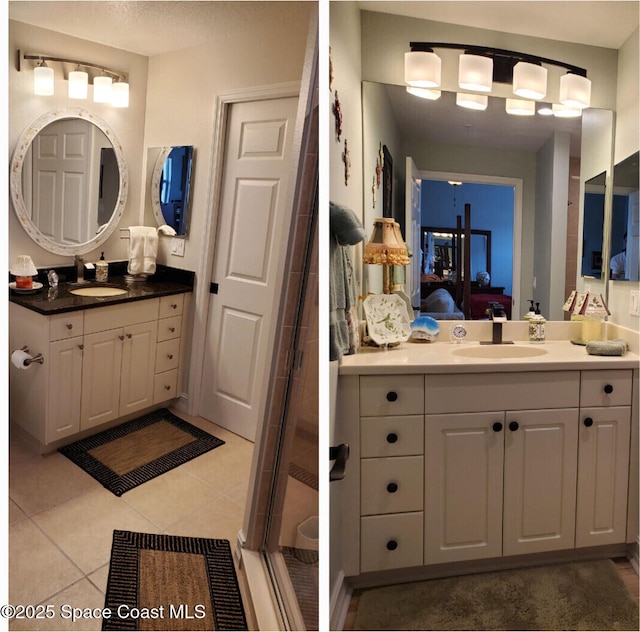 93 Delannoy Ave Unit 601, Cocoa, FL 32922 - bathroom with ensuite bathroom, two vanities, tile patterned flooring, and a shower stall