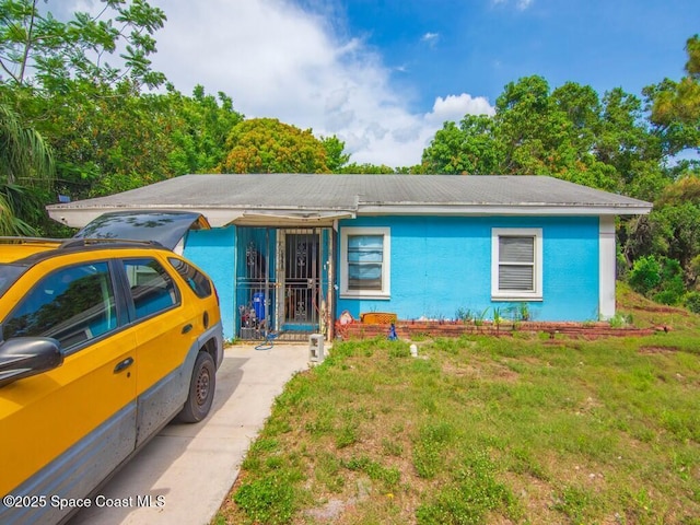 308 N 18th Ct, Ft Pierce, FL 34950 - ranch-style house with stucco siding