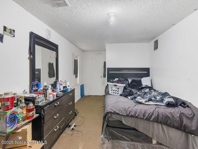 308 N 18th Ct, Ft Pierce, FL 34950 - bedroom featuring light carpet and a textured ceiling
