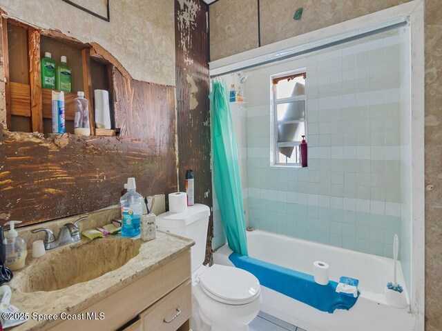 308 N 18th Ct, Ft Pierce, FL 34950 - bathroom featuring toilet, vanity, and shower / bath combination with curtain
