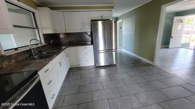 1666 Terrace St, Cocoa, FL 32922 - kitchen featuring freestanding refrigerator, range with electric stovetop, a sink, backsplash, and ornamental molding