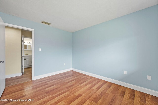 714 Catalina Rd Unit 15, Cocoa Beach, FL 32931 - empty room with light wood finished floors and baseboards
