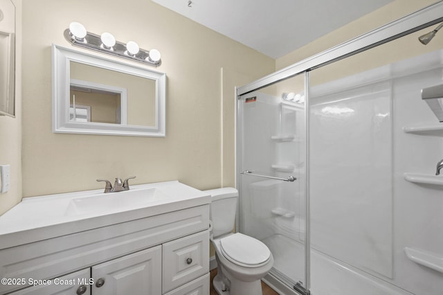 714 Catalina Rd Unit 15, Cocoa Beach, FL 32931 - bathroom with a shower with shower door, vanity, and toilet
