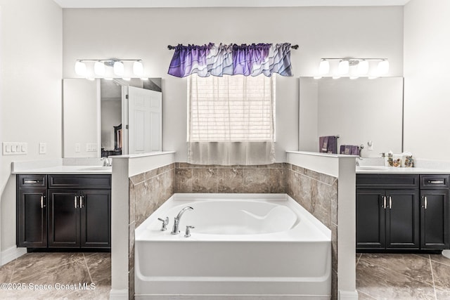 14880 Ellingsworth Ln, Winter Garden, FL 34787 - full bath featuring two vanities, a bath, and marble look tile flooring