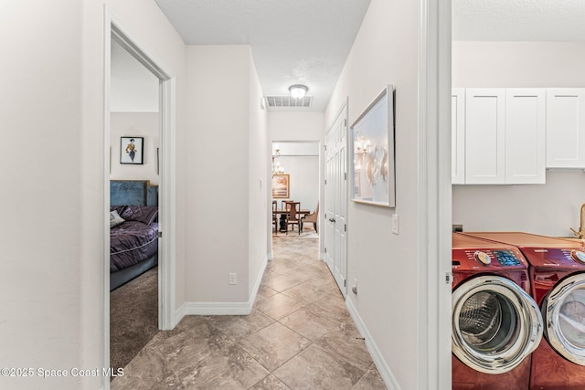 14880 Ellingsworth Ln, Winter Garden, FL 34787 - washroom with washer and dryer and baseboards