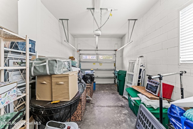 14880 Ellingsworth Ln, Winter Garden, FL 34787 - garage featuring a garage door opener and concrete block wall