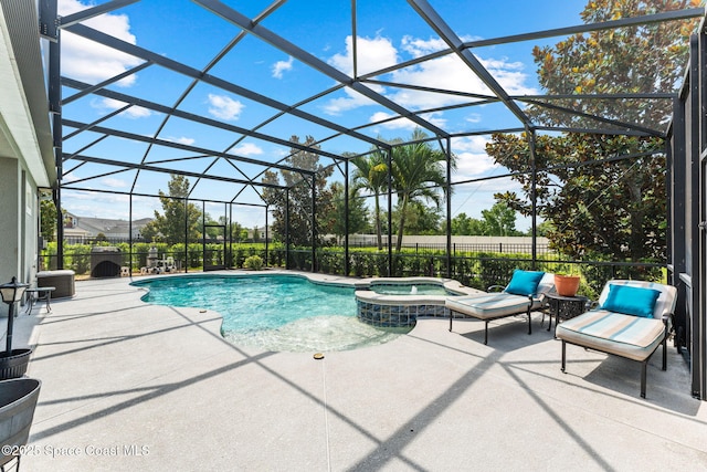 14880 Ellingsworth Ln, Winter Garden, FL 34787 - view of swimming pool with a pool with connected hot tub, a patio, and glass enclosure