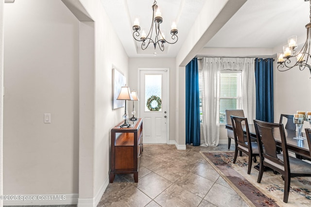 14880 Ellingsworth Ln, Winter Garden, FL 34787 - foyer entrance with a chandelier, plenty of natural light, and baseboards