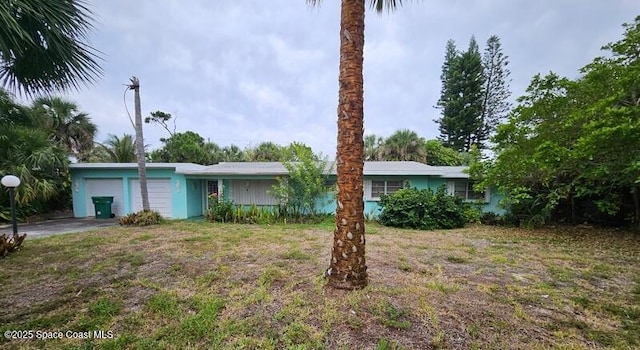 2240 Sea Ave, Indialantic, FL 32903 - ranch-style home with an attached garage and driveway