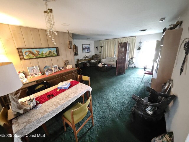 2240 Sea Ave, Indialantic, FL 32903 - carpeted dining room with wooden walls