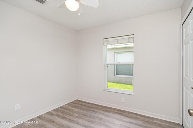 1102 Bainbury Ln, Melbourne, FL 32904 - unfurnished bedroom featuring wood finished floors, a closet, and ceiling fan