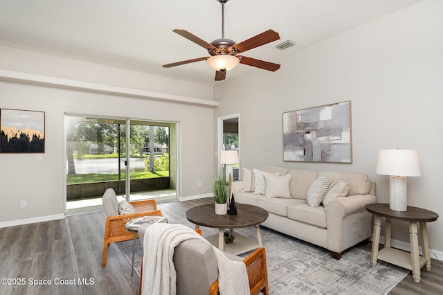 1102 Bainbury Ln, Melbourne, FL 32904 - living room with wood finished floors, a ceiling fan, and a textured ceiling