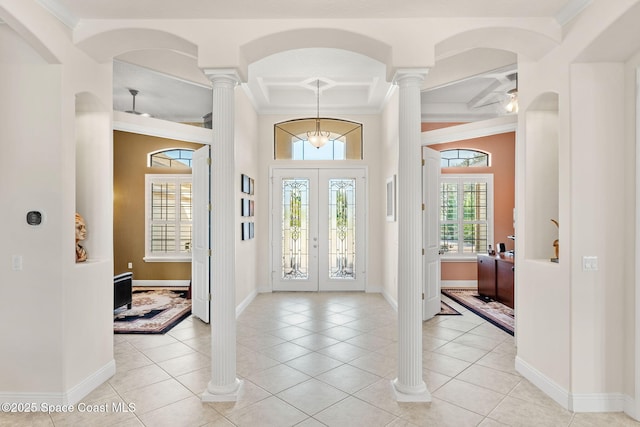 4022 Tradewinds Trl, Merritt Island, FL 32953 - foyer entrance featuring ornamental molding, a high ceiling, coffered ceiling, light tile patterned floors, and decorative columns