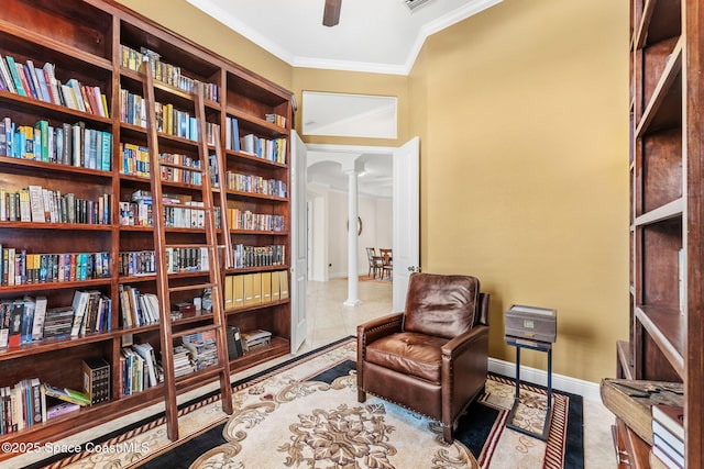 4022 Tradewinds Trl, Merritt Island, FL 32953 - sitting room featuring ornate columns, ornamental molding, ceiling fan, and bookshelves