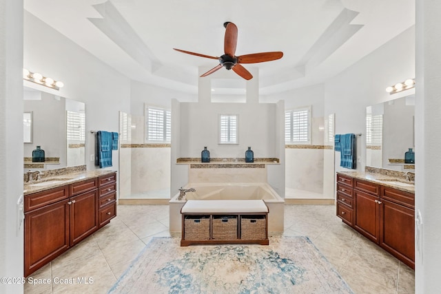 4022 Tradewinds Trl, Merritt Island, FL 32953 - bathroom with a raised ceiling, a ceiling fan, and walk in shower