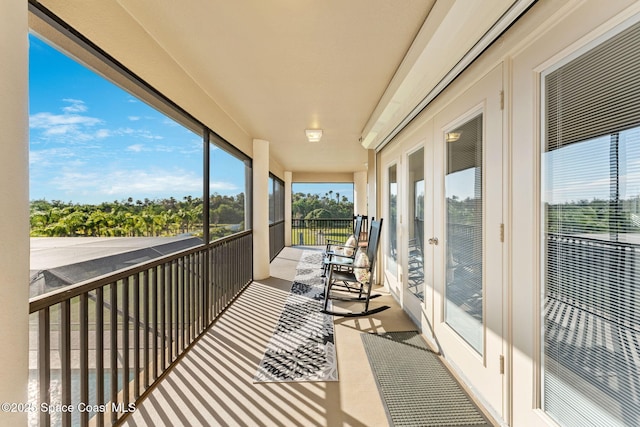 4022 Tradewinds Trl, Merritt Island, FL 32953 - sunroom with carpet floors and a heating unit