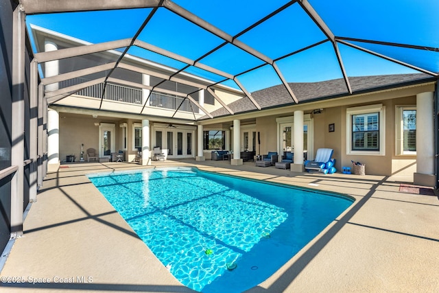 4022 Tradewinds Trl, Merritt Island, FL 32953 - outdoor pool with an outdoor living space, a ceiling fan, a patio, french doors, and glass enclosure