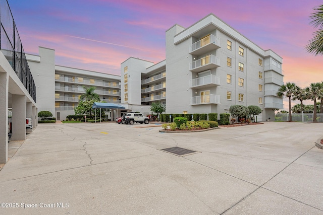 8700 Ridgewood Ave Unit Ph2B, Cape Canaveral, FL 32920 - property at dusk with uncovered parking