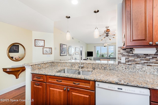 8700 Ridgewood Ave Unit Ph2B, Cape Canaveral, FL 32920 - kitchen featuring dishwasher, a sink, ceiling fan, dark wood-style flooring, and light stone countertops