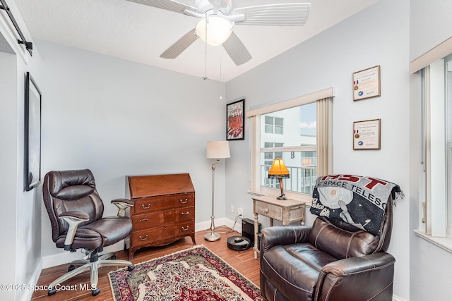 8700 Ridgewood Ave Unit Ph2B, Cape Canaveral, FL 32920 - sitting room with wood finished floors, plenty of natural light, ceiling fan, and baseboards
