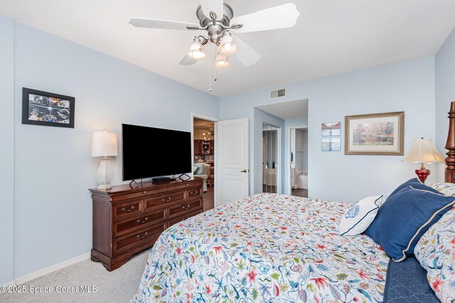 8700 Ridgewood Ave Unit Ph2B, Cape Canaveral, FL 32920 - bedroom with light carpet, baseboards, and a ceiling fan